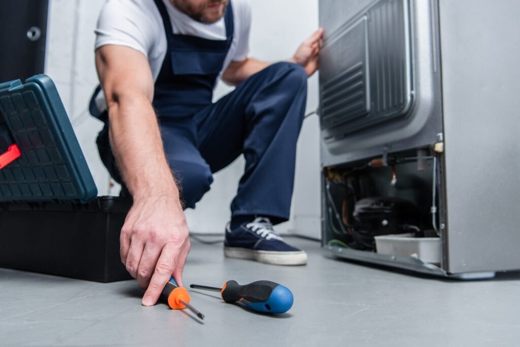 Busy Sioux Falls man working on dryer heating coils for appliance maintenance hack