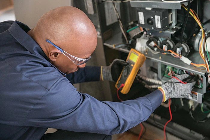 Homeowner troubleshooting HVAC system in Sioux Falls winter home